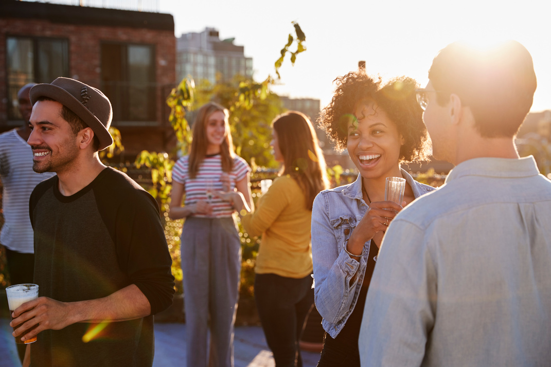 Happy Friends at a Rooftop Party 